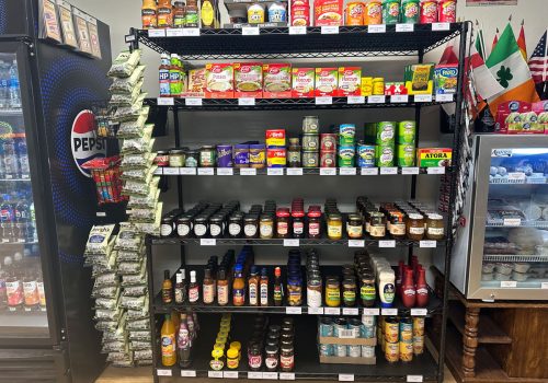 Shelves filled with various canned foods, sauces, and jars from Britain