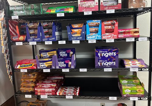 Shelves filled with various chocolates and sweets from Britain